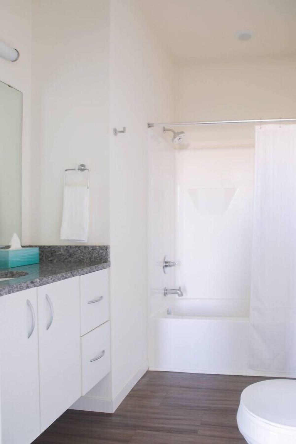 Refresh in the clean, contemporary bathroom featuring a full-sized soaking tub and sleek fixtures