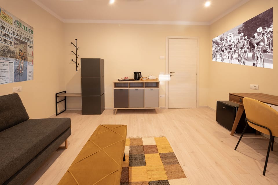 Deluxe Suite, Balcony, Garden View | Living area | 55-inch Smart TV with satellite channels, offices