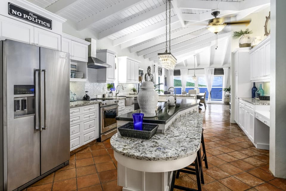 The spacious and well-appointed kitchen with the dining room in the background!