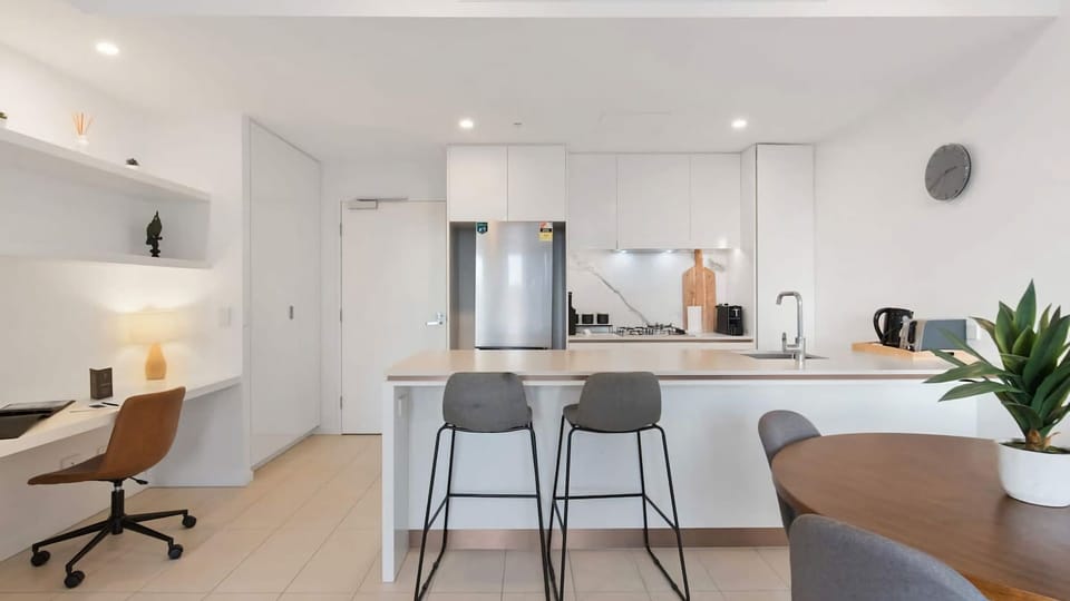 The kitchen area boasts high quality stainless-steel appliances (as shiny and new as the apartment itself!) including an electric oven, gas stove-top and dishwasher.