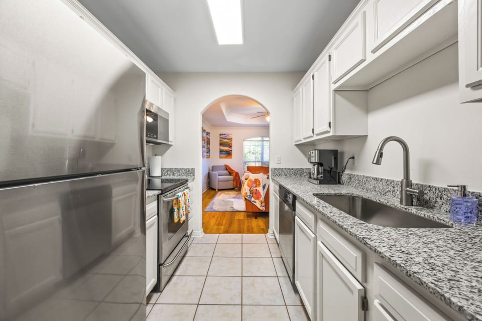 Our shiny kitchen opens up to our sunny living room.