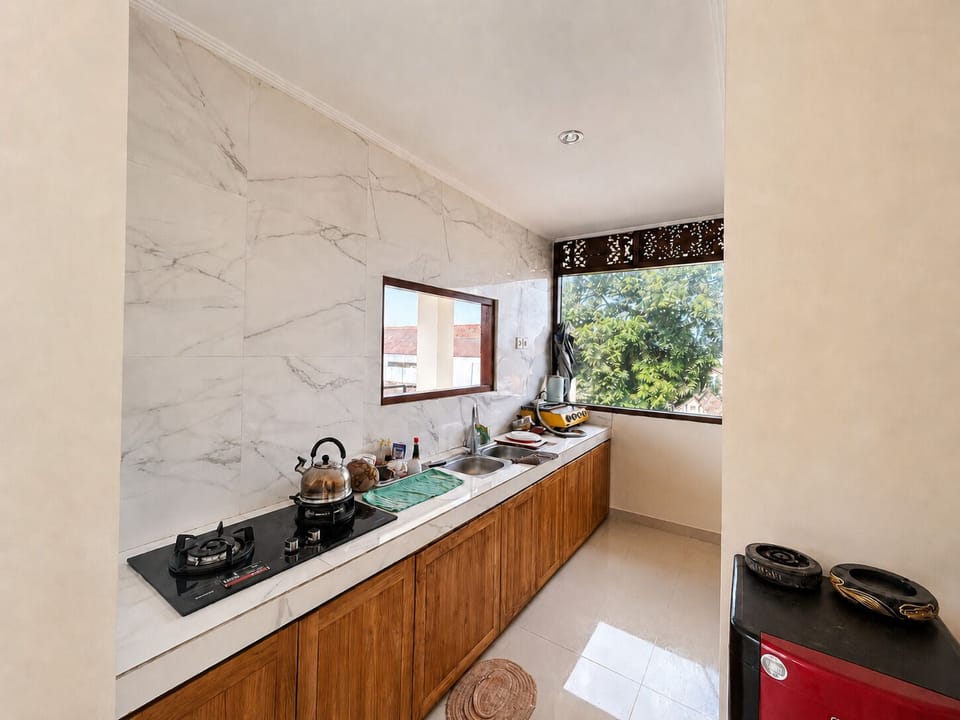 Double Room, City View | Shared kitchen facilities | Coffee/tea maker, shared fridge, shared microwave, electric kettle