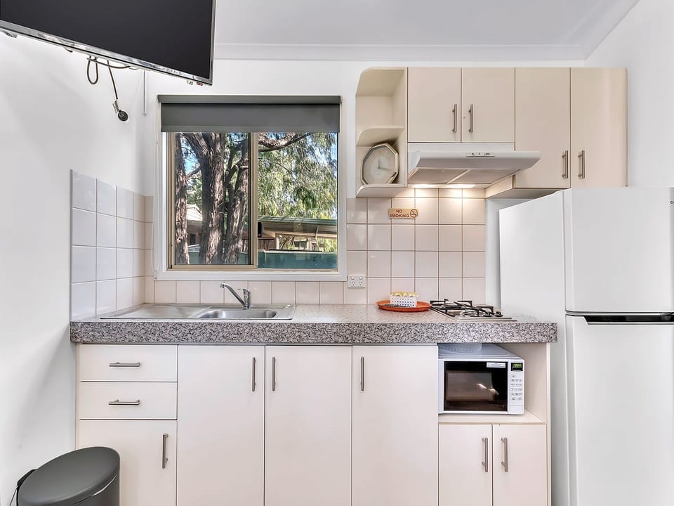 Standard 1 Bedroom Cabin | Private kitchen | Full-size fridge, microwave, stovetop, toaster