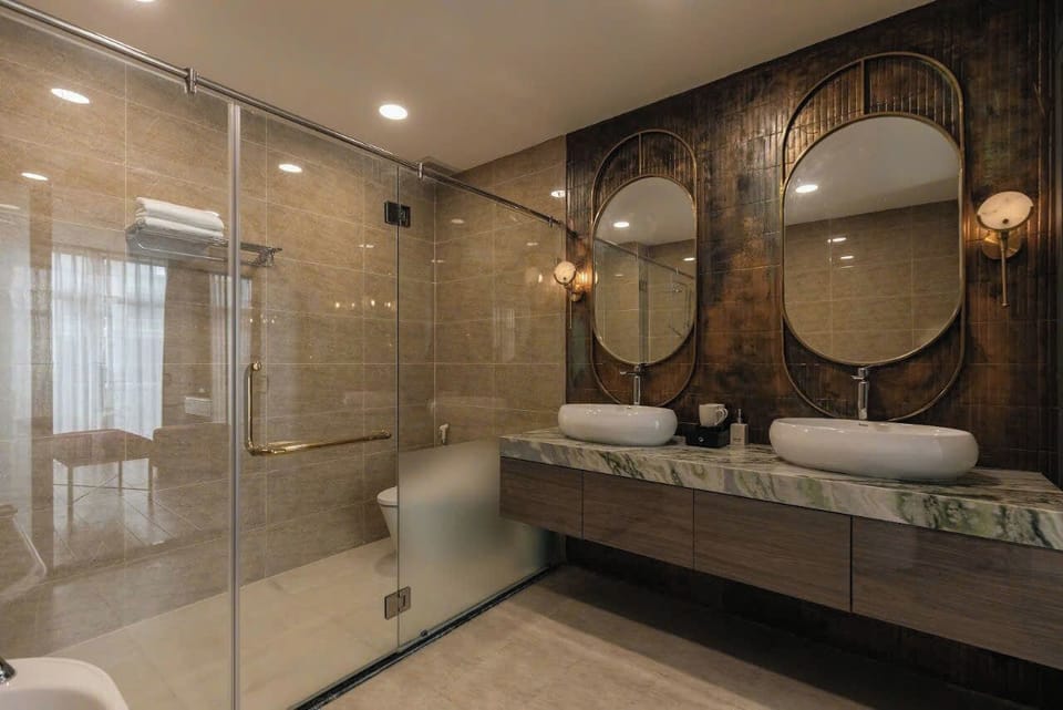 Luxury Suite, Park View | Bathroom | Rainfall showerhead, free toiletries, hair dryer, slippers
