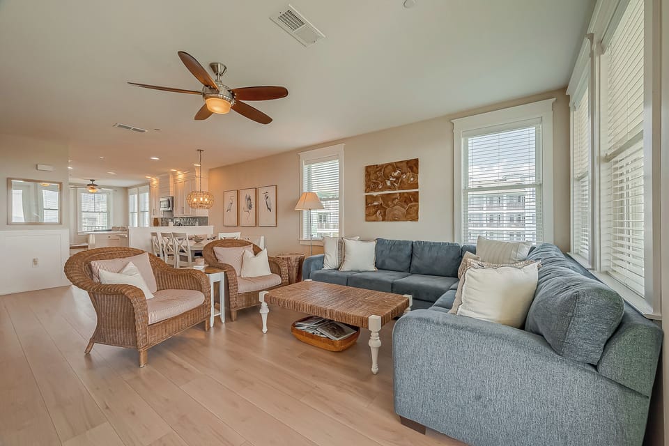 Cozy wicker chairs and sectional for relaxing.
