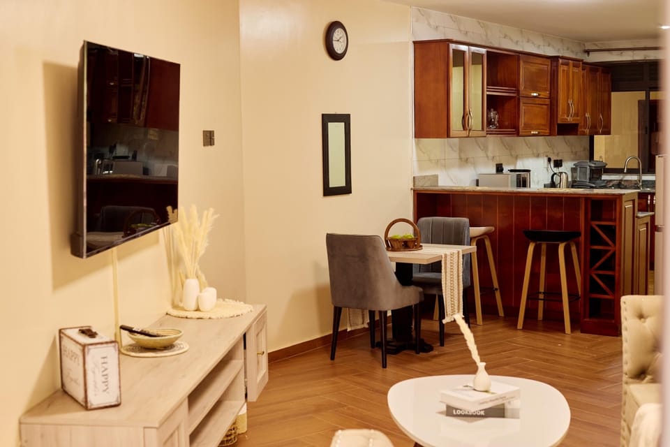 Deluxe Apartment, City View | Living area | Flat-screen TV
