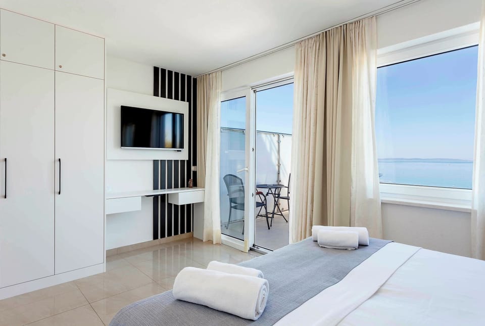 Quadruple Room, Balcony, Sea View | Blackout drapes, iron/ironing board, free WiFi, bed sheets