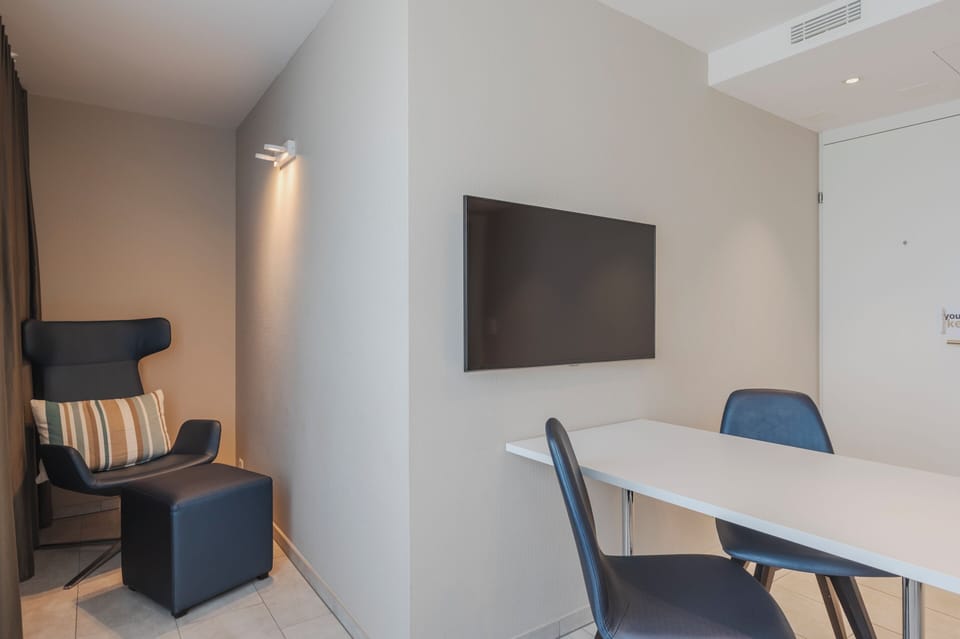 Classic Double Room | Living area | 32-inch LED TV with cable channels