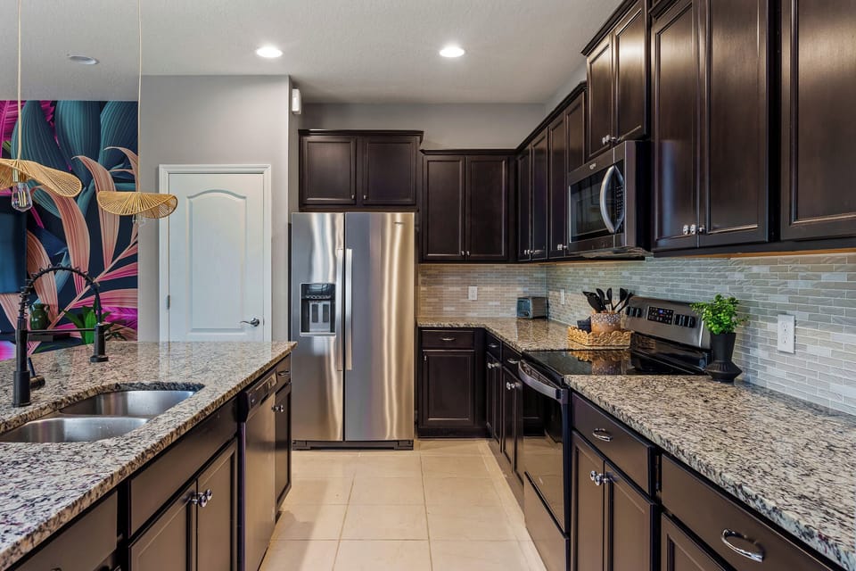 The sleek and neatly designed kitchen has all the basic essentials you need!