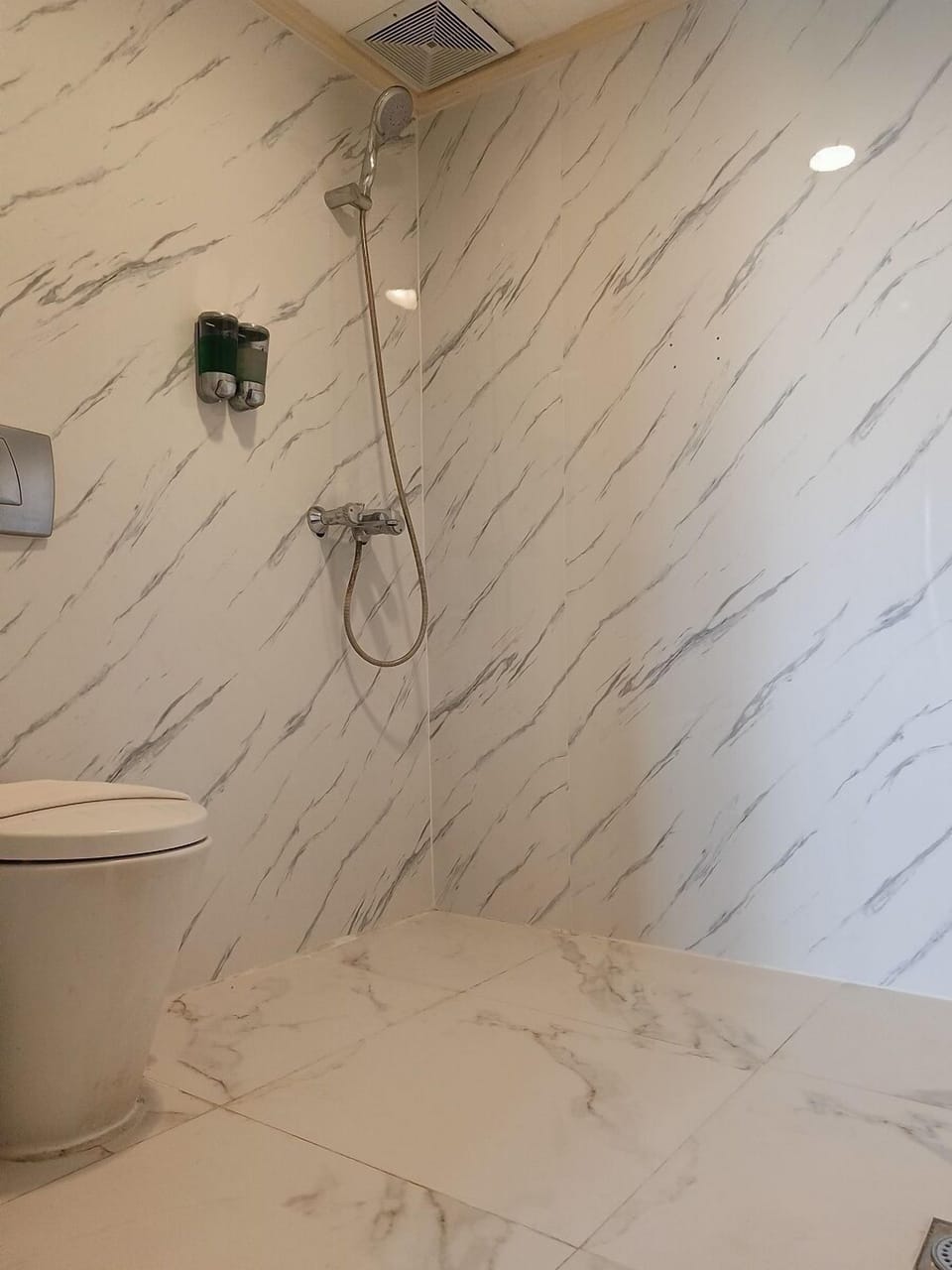 Shower, free toiletries, slippers, towels