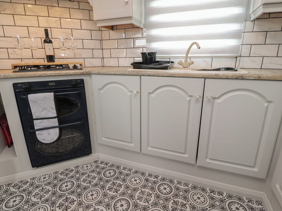 Fridge, electric kettle, toaster, cookware/dishes/utensils