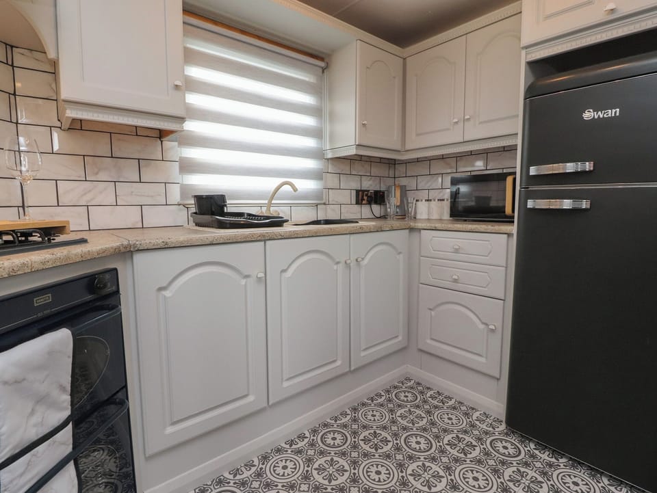 Fridge, electric kettle, toaster, cookware/dishes/utensils