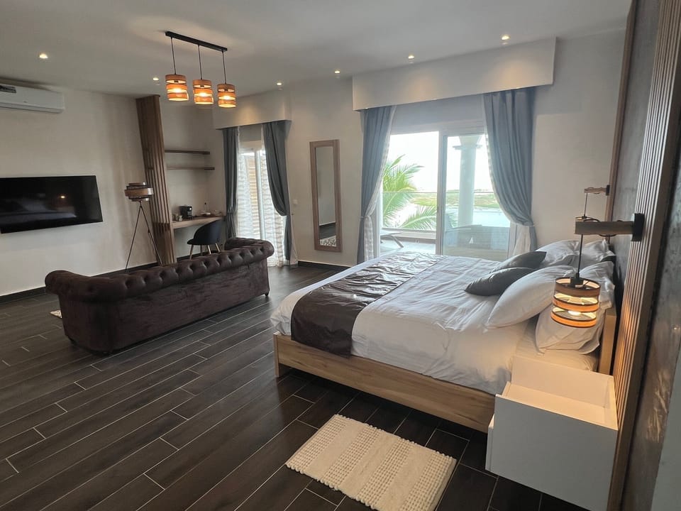 Deluxe Suite, Patio, Sea View | Egyptian cotton sheets, premium bedding, pillowtop beds, free minibar
