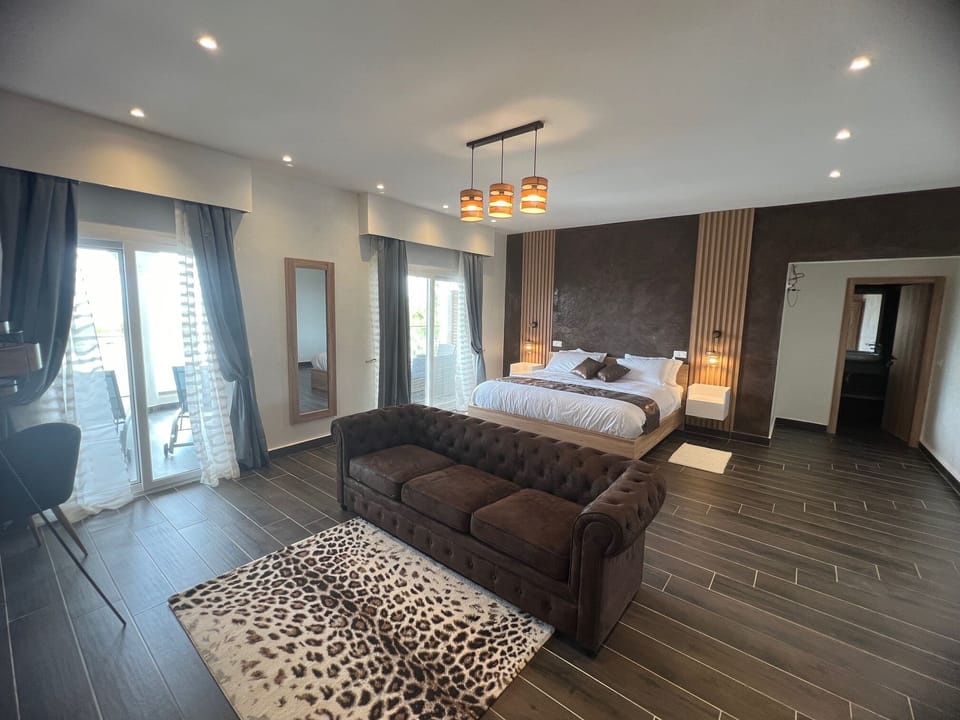 Deluxe Suite, Patio, Sea View | Egyptian cotton sheets, premium bedding, pillowtop beds, free minibar