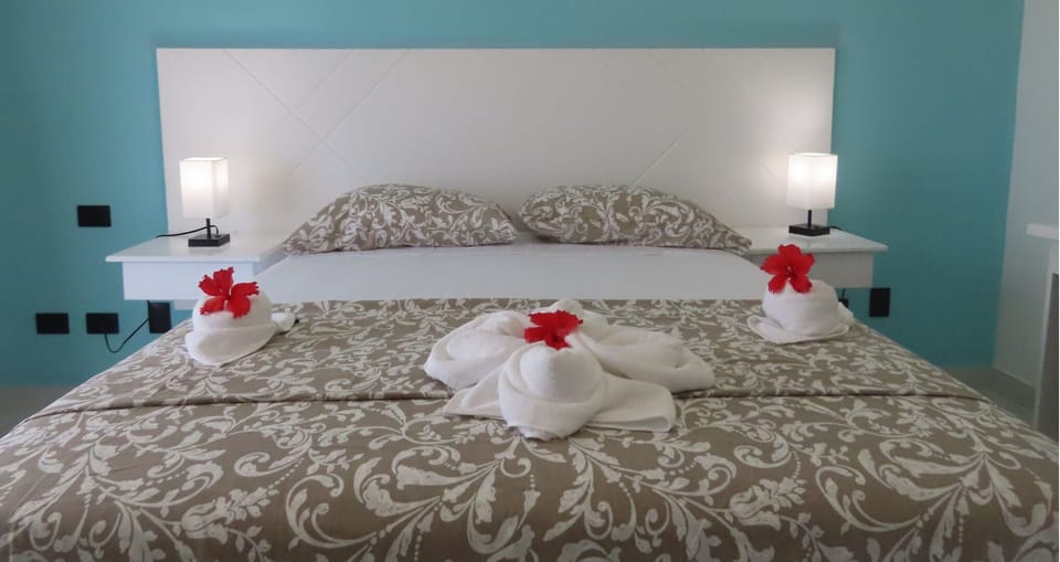 Standard Queen - Street View | Down comforters, pillowtop beds, in-room safe, blackout drapes