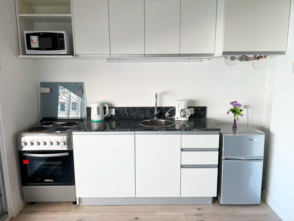 Studio | Private kitchen | Electric kettle, dining tables