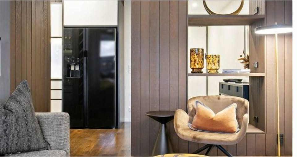 Interiors favour clean lines, layered textures and a muted coastal palette.