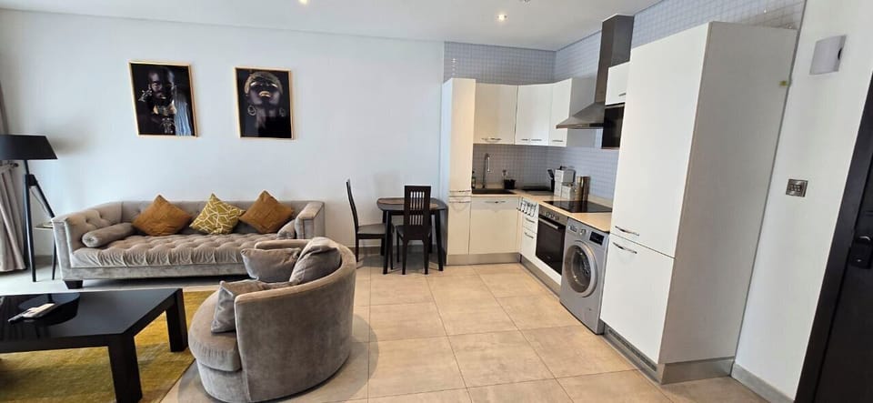 Deluxe Apartment | Living area | Flat-screen TV