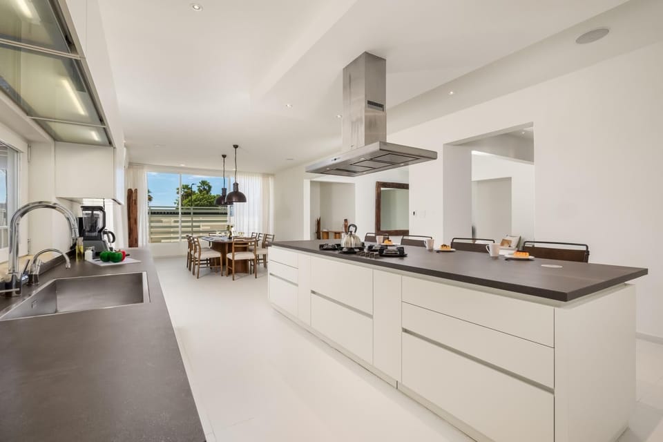 Equipped with state-of-the-art appliances and plenty of counter space, this kitchen is designed for both convenience and style.