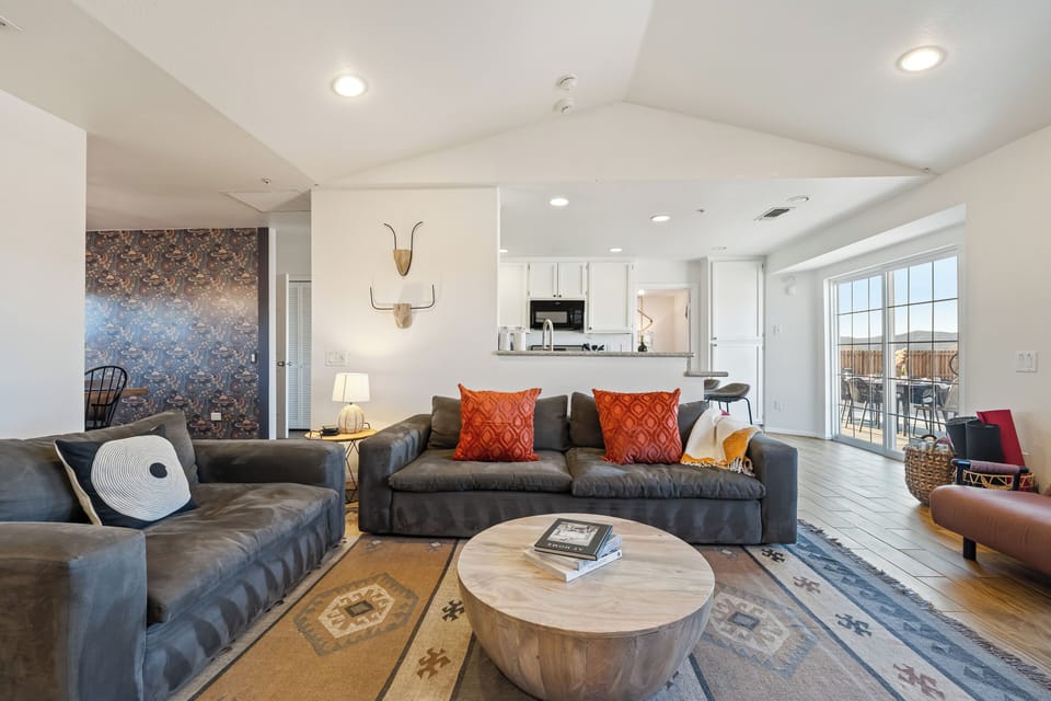 Bright and inviting living area with plush seating and open layout.