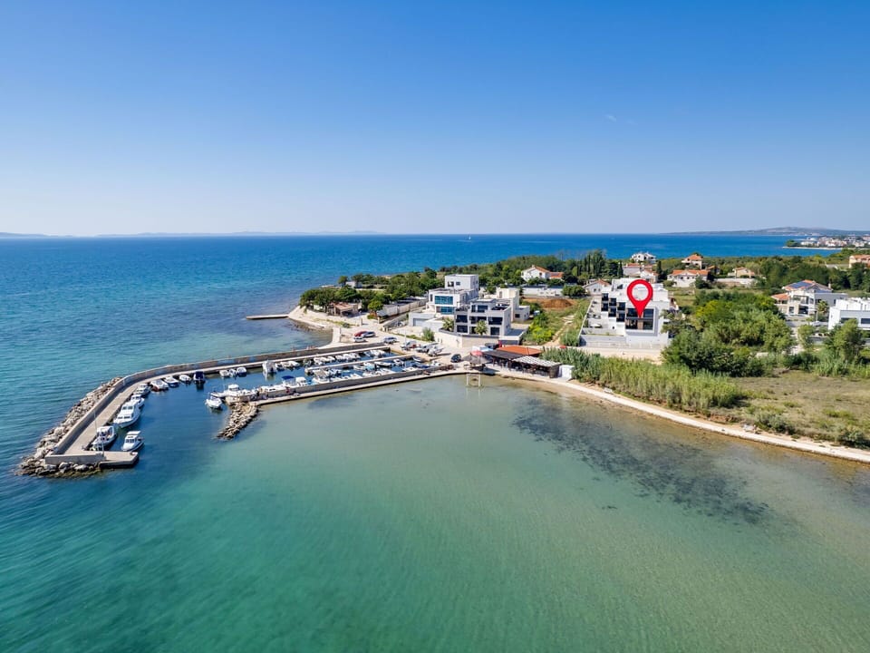 Water, Sky, Building, Azure, Beach, Coastal And Oceanic Landforms, Natural Landscape, Landscape, Leisure, Horizon
