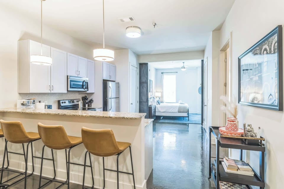 Sip morning coffee or enjoy gourmet bites at the kitchen counter, seating 4