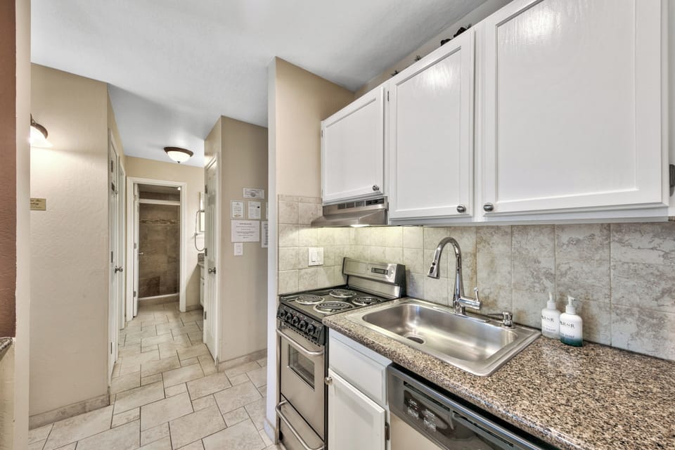 Your fully equipped kitchen features granite countertops, stainless steel appliances, and everything you need to prepare delicious meals during your stay.