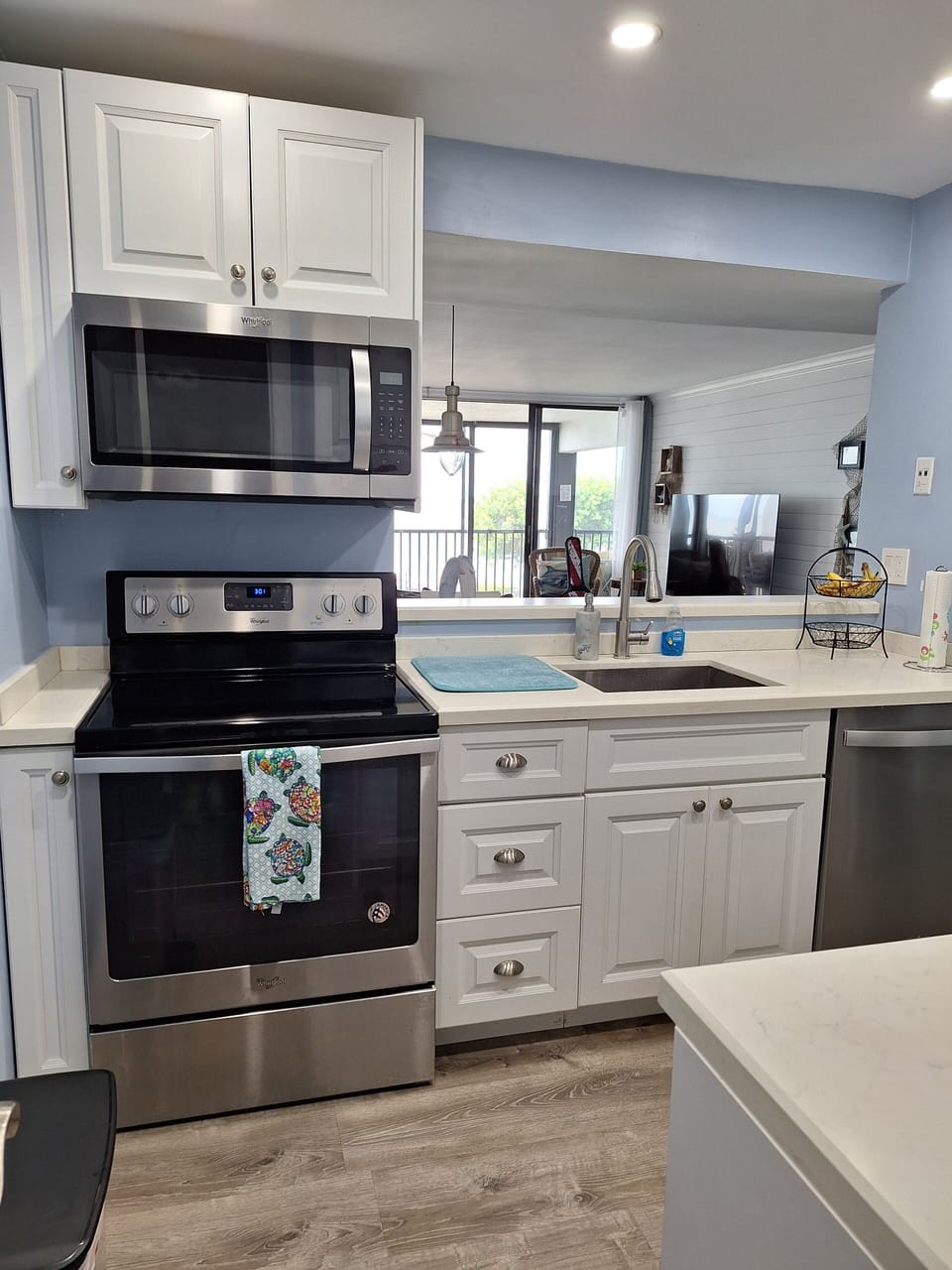 Full kitchen with view of open water while cooking