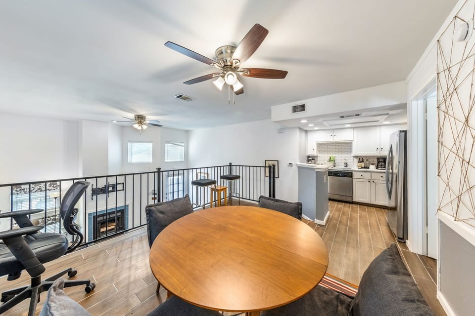 Dining space overlooking the open loft—perfect for meals or an additional workspace.