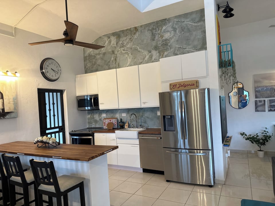 New kitchen with dishwasher, microwave, stove, sink w/garbage disposal, fridge.