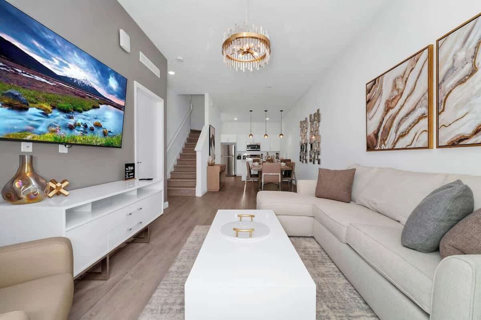 Spacious living room with a smart TV, perfect for movie nights and relaxation after a day of adventures.