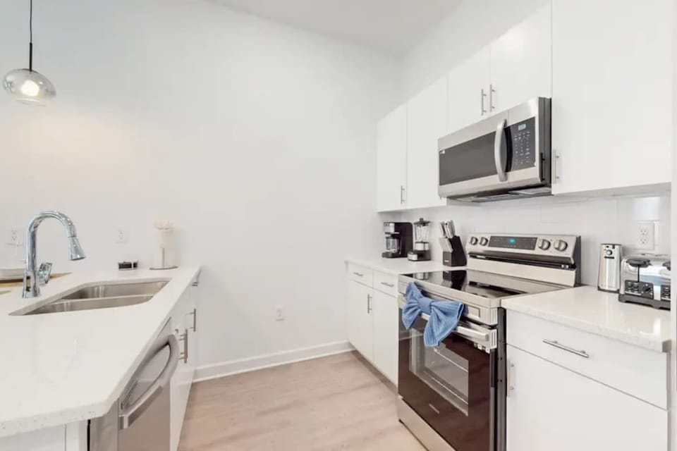 Cook with ease in the fully stocked kitchen with modern appliances.