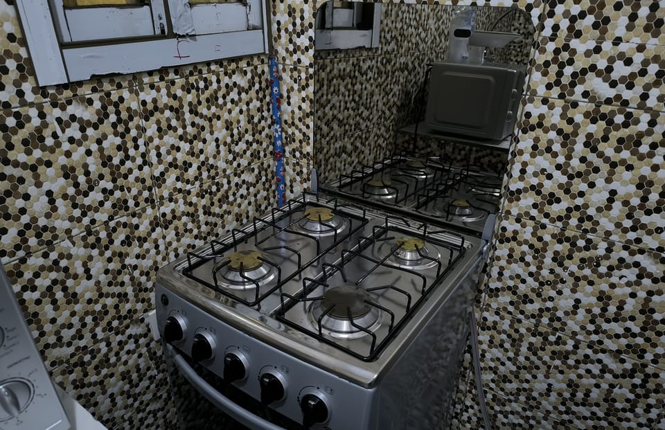 Mini-fridge, microwave, oven, cookware/dishes/utensils