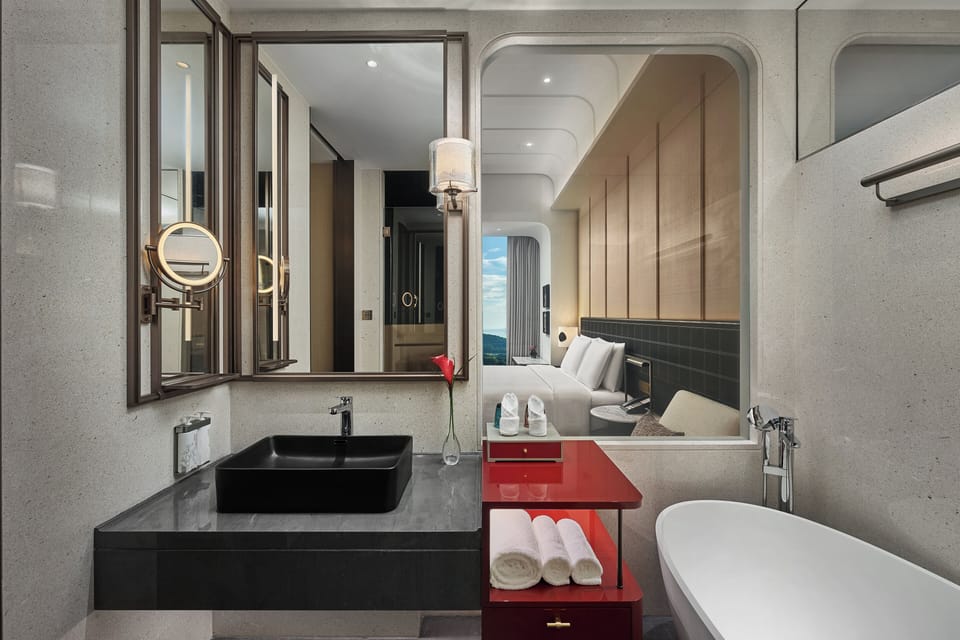 Designer toiletries, hair dryer, bathrobes, slippers
