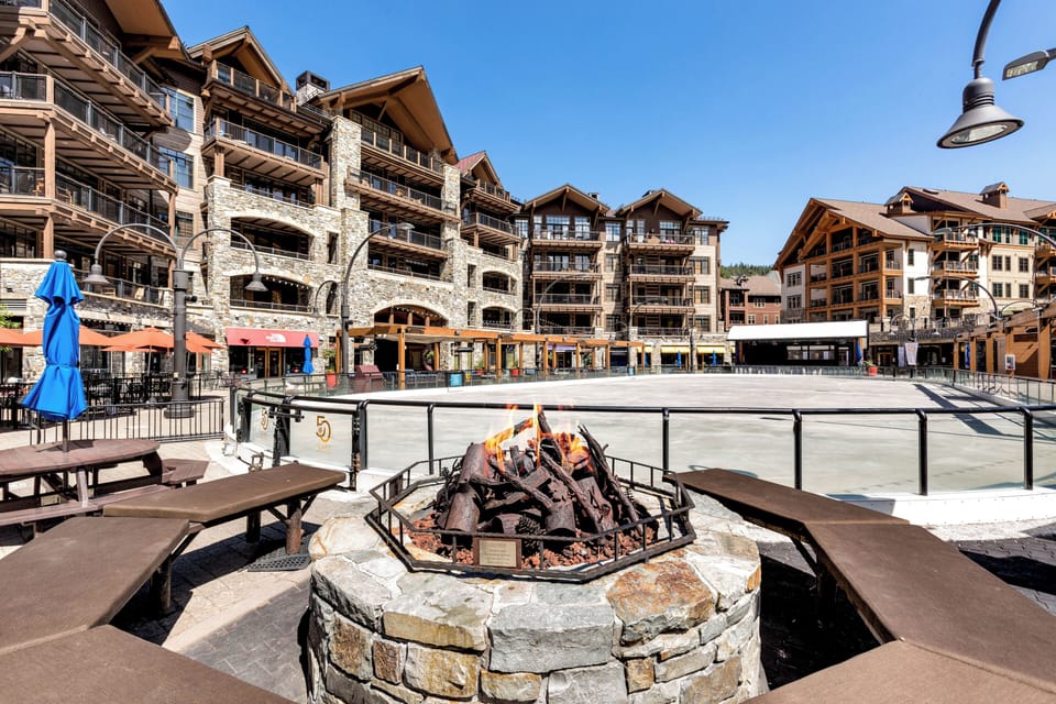 Gather around the outdoor fire pit for cozy evenings with friends, surrounded by the charm of the lodge-style architecture.