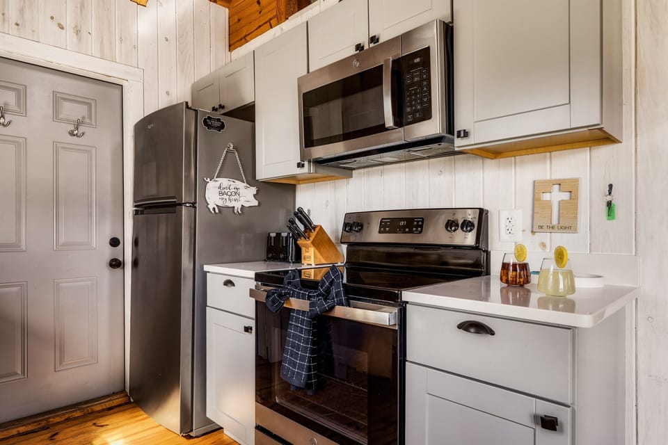 Come create your own culinary masterpiece and indulge in a completely updated modern kitchen. Features fully stocked cookware, microwave, oven, dishwasher and fridge.