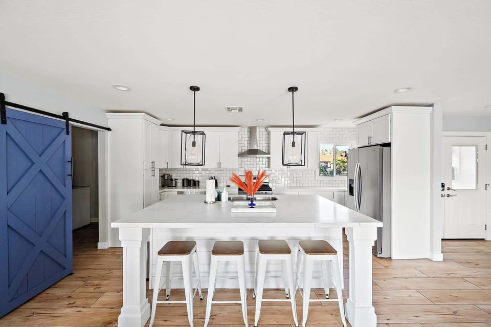 Welcome to culinary heaven! Our fully stocked kitchen boasts a large island with high seating for the perfect blend of style and functionality.