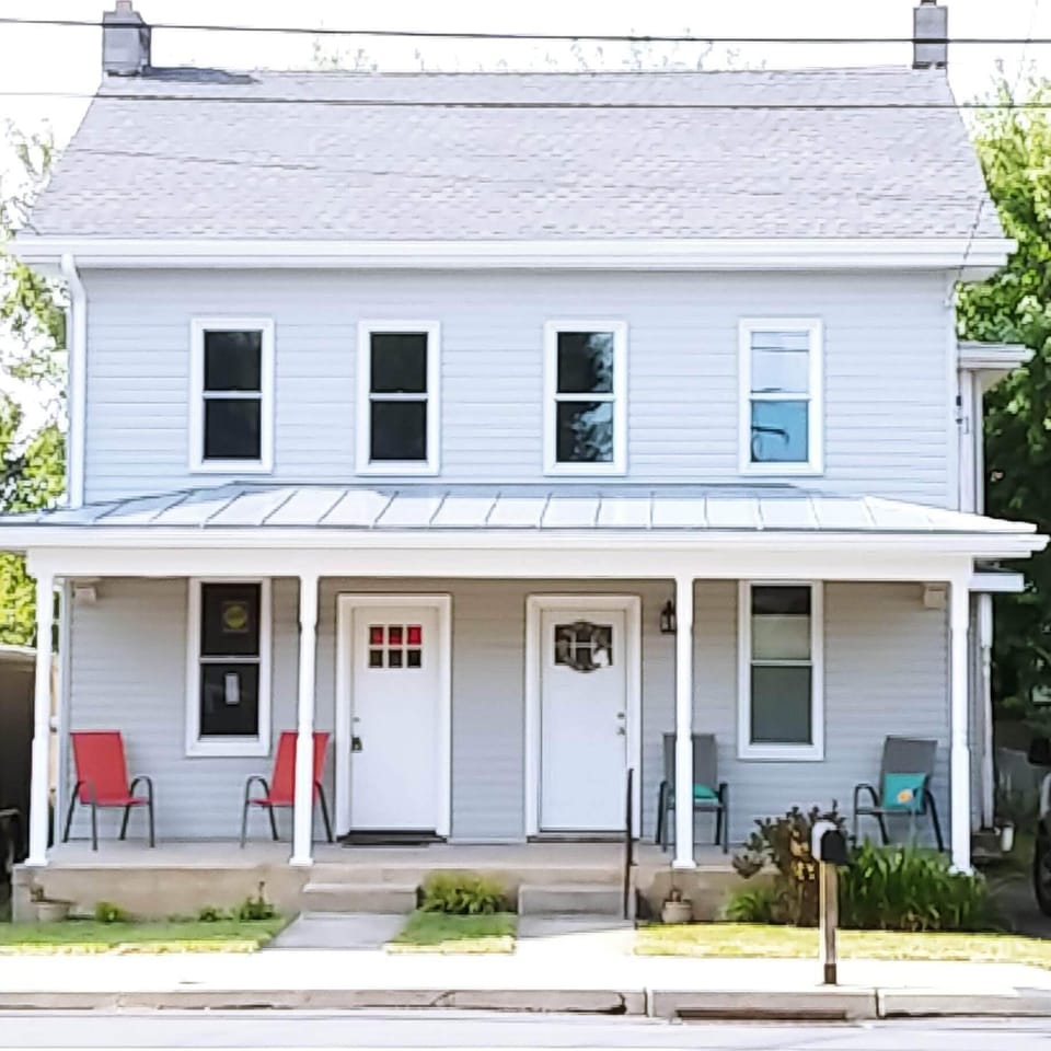 Exterior, front. Property is left side of duplex.