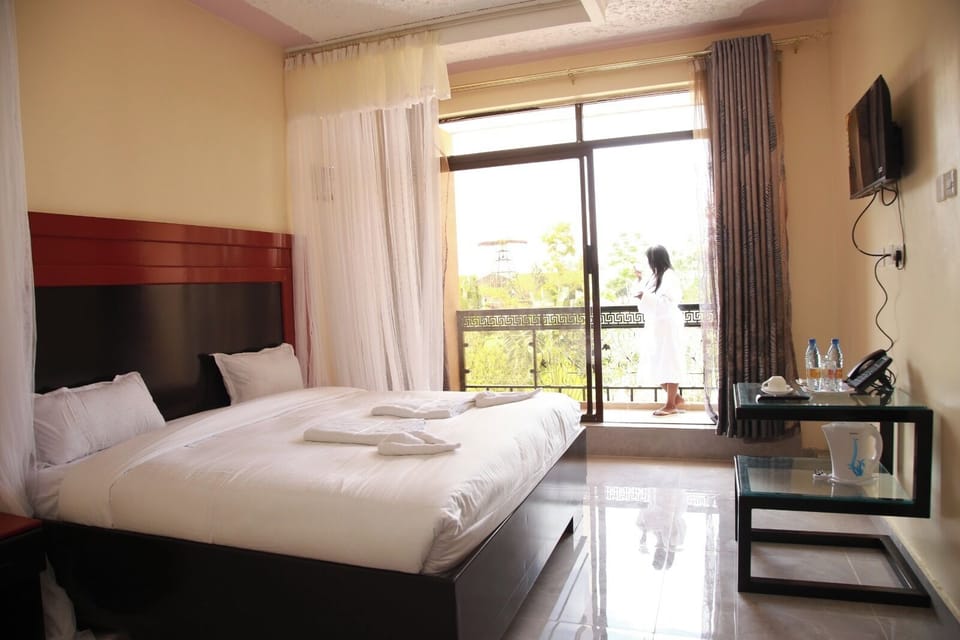 Deluxe Double Room, Balcony, Garden View | Desk, laptop workspace, free WiFi
