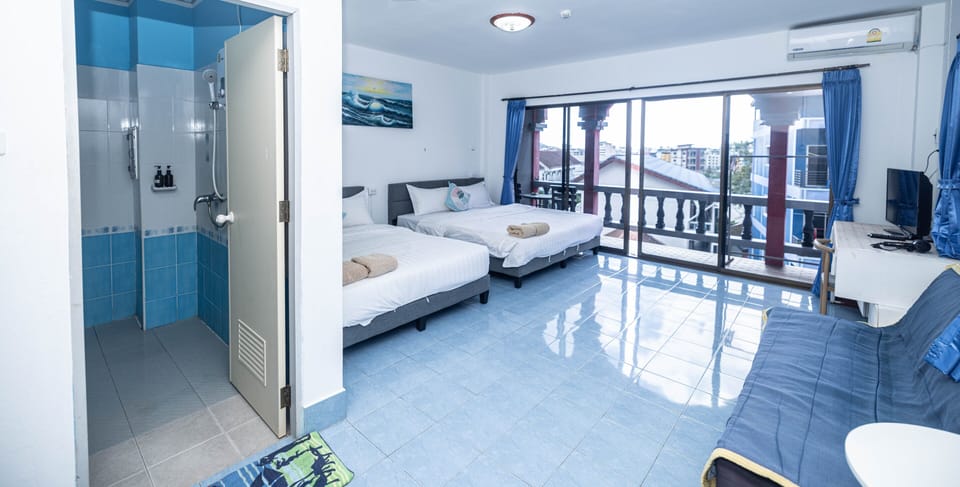 Comfort Quadruple Room, Balcony, City View | Down comforters, in-room safe, blackout drapes, free WiFi