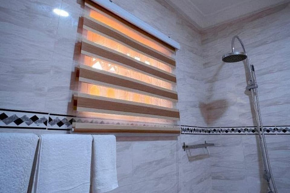 Separate tub and shower, deep soaking tub, towels