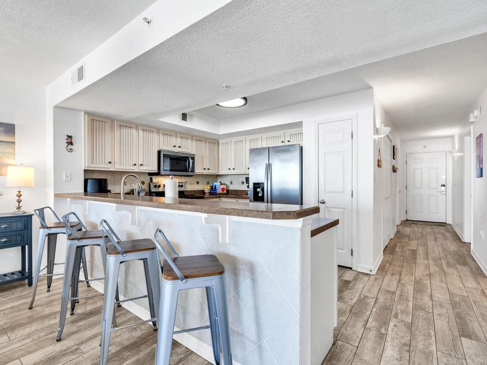 Your modern kitchen awaits with granite counters, stainless appliances, and stylish bar seating—perfect for morning coffee or casual meals together.