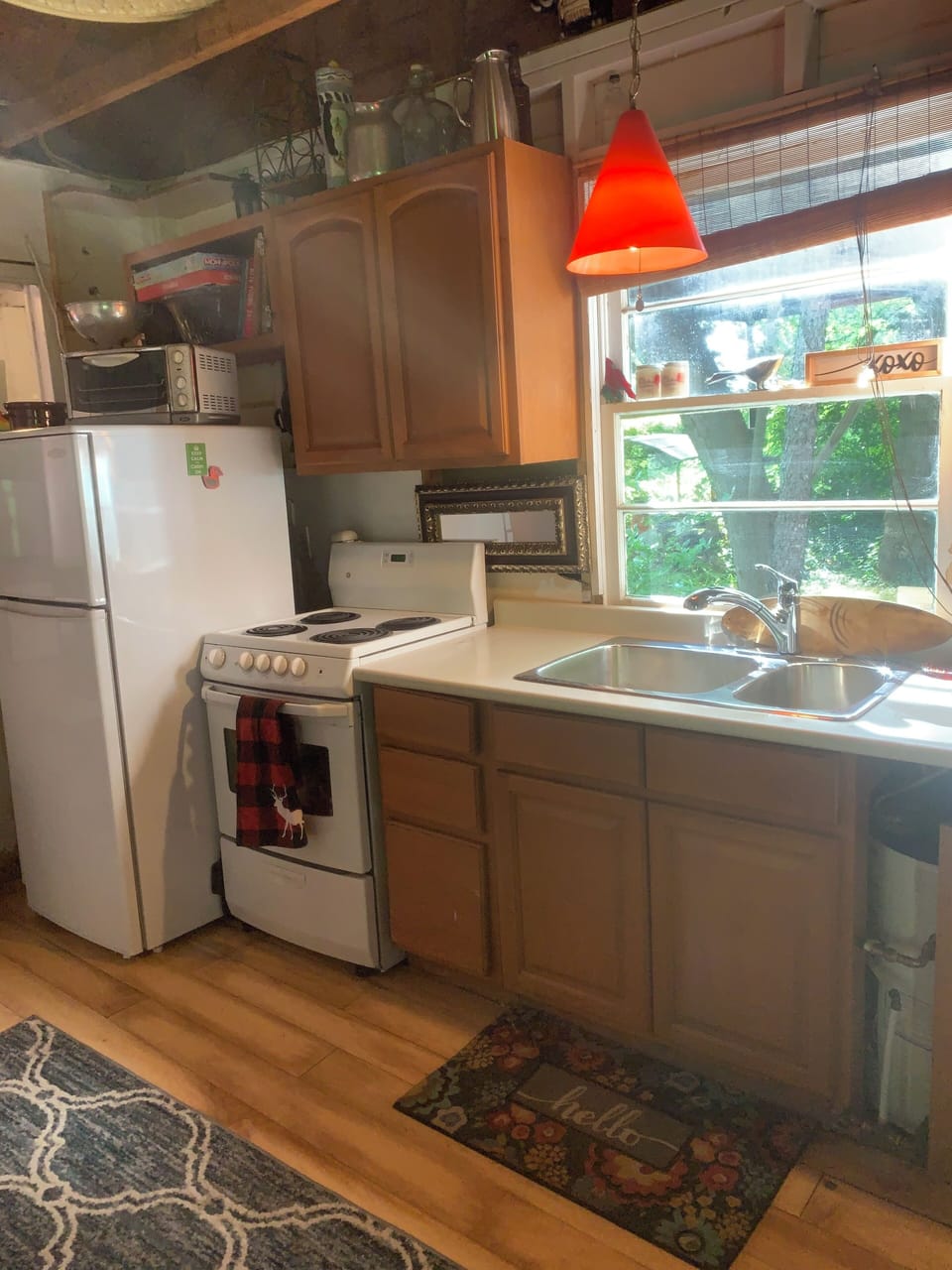 Full kitchen with sunny window look out
