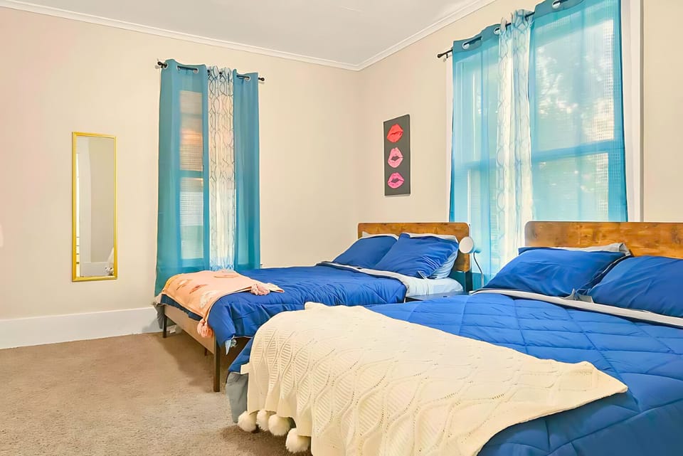 Rest easy in this serene blue bedroom, a soothing space for a good night's sleep