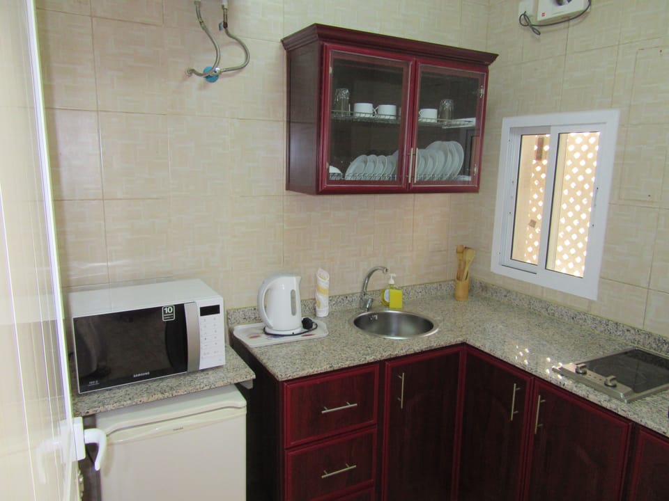 Family Apartment, 1 King Bed, City View | 1 bedroom, in-room safe, desk, iron/ironing board (on request)