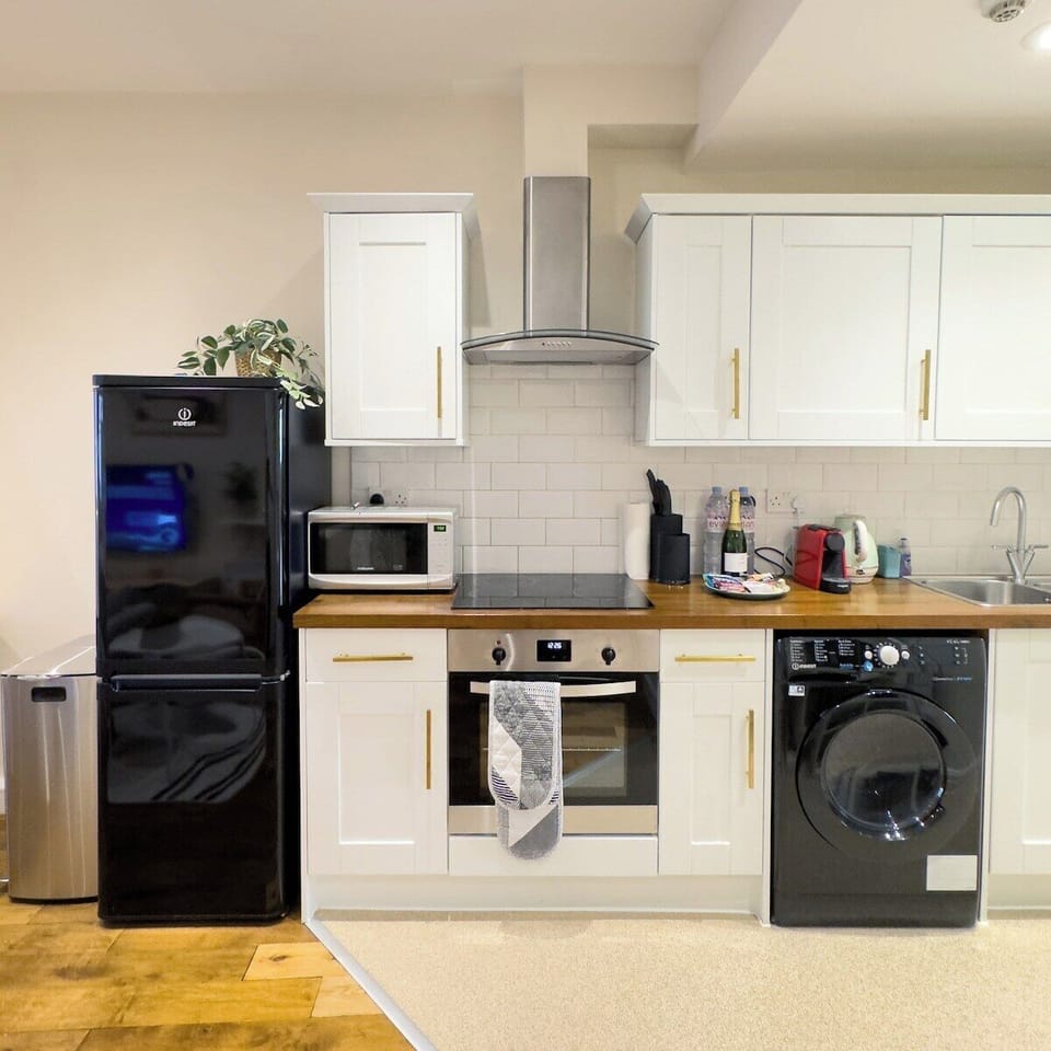 Full Kitchen compromising of fridge, oven, microwave, washer, kettle, air fryer & espresso machine 