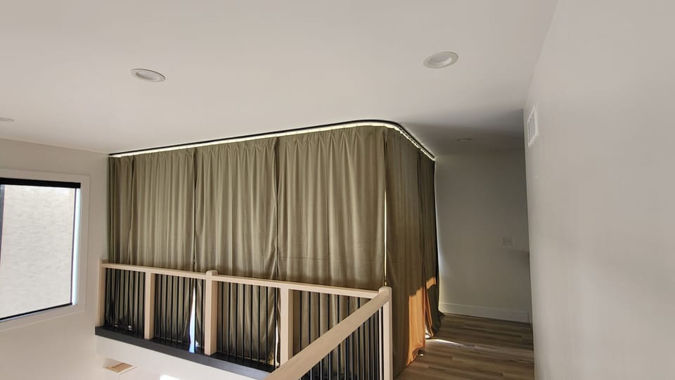 Loft with heavy privacy curtain closed