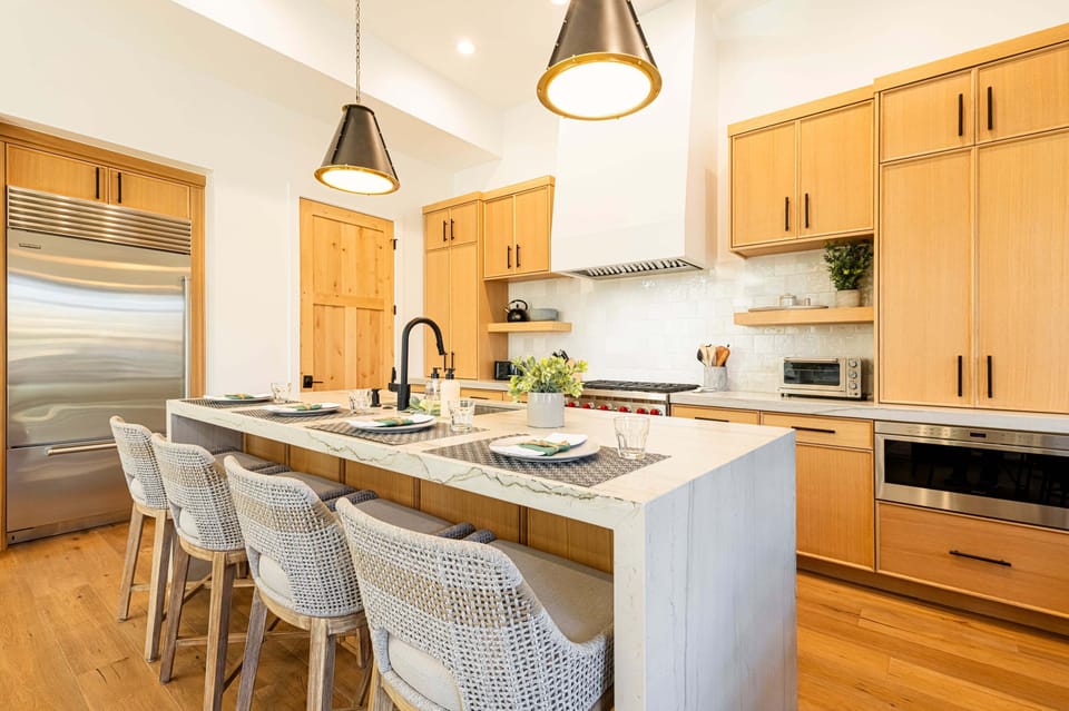 Chef's kitchen with premium appliances including a Wolf 6-burner gas range and SubZero refrigerator/freezer