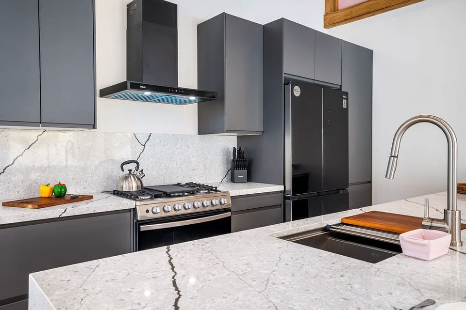 Love to cook on vacation? Our villa’s fully equipped kitchen has everything you need for your culinary creations. From modern appliances to ample counter space, this sleek, stylish kitchen is perfect for whipping up delicious meals.