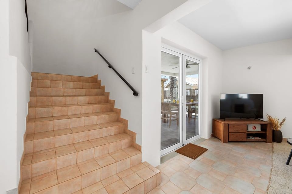 The staircase in this home is both functional and stylish, offering a smooth transition between floors.